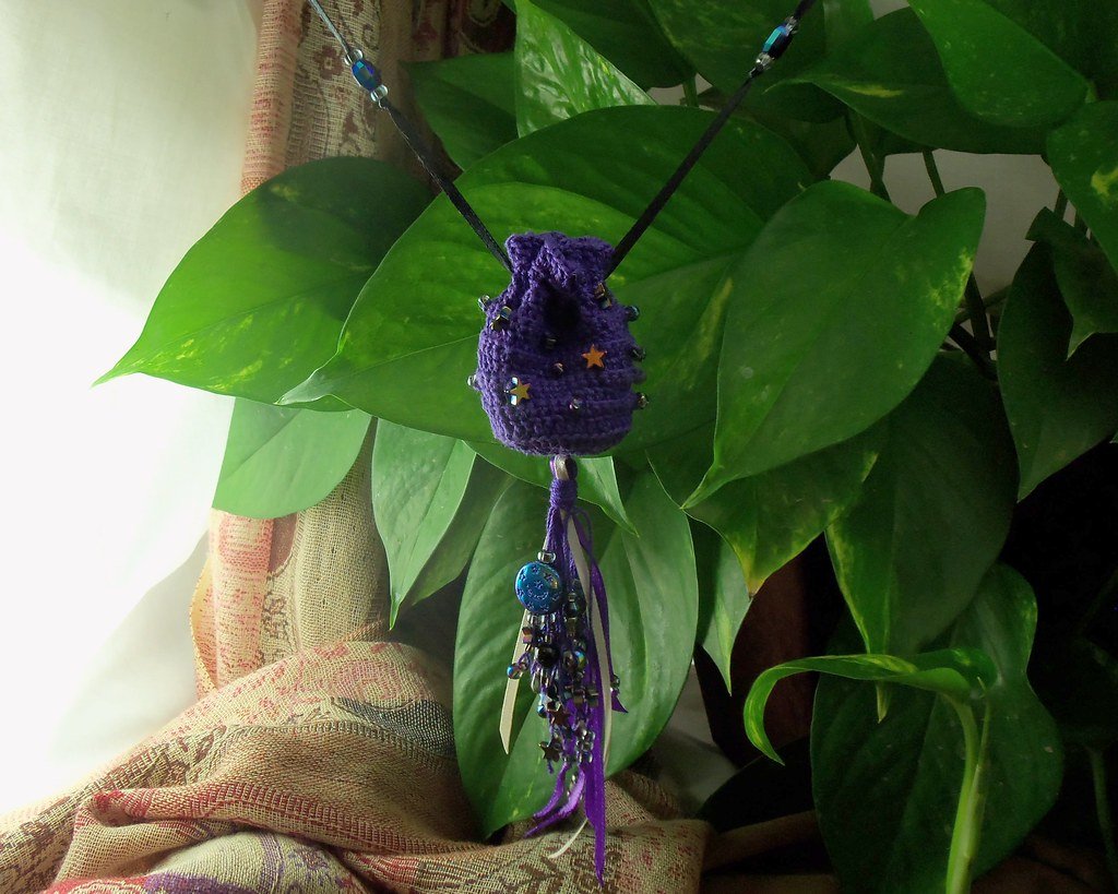 A small crochet drawstring pouch