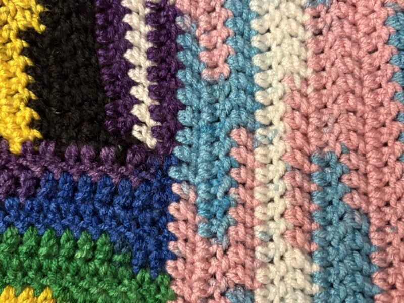Close-up of rows of crochet stitches in different colours